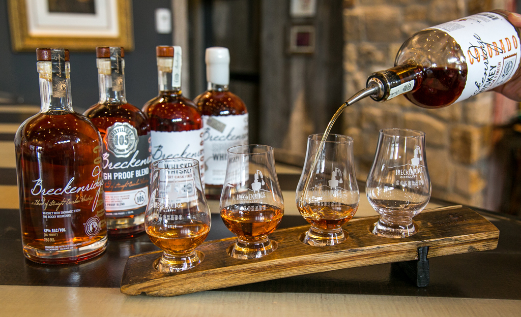 whiskey being poured into glasses